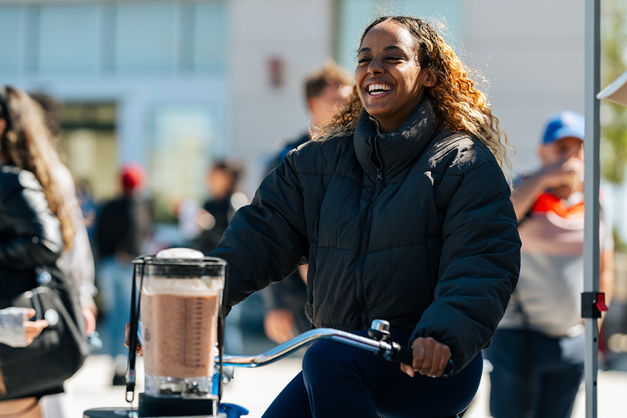 Student rides the smoothie bike.