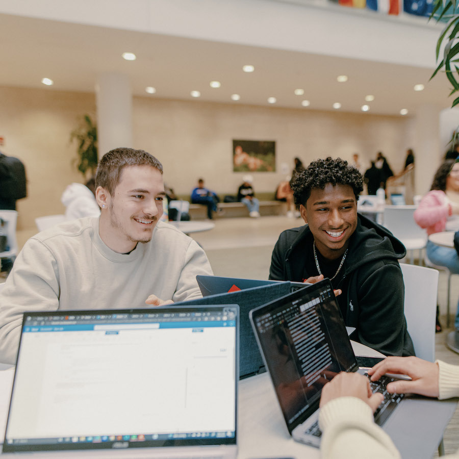 Male students on laptops