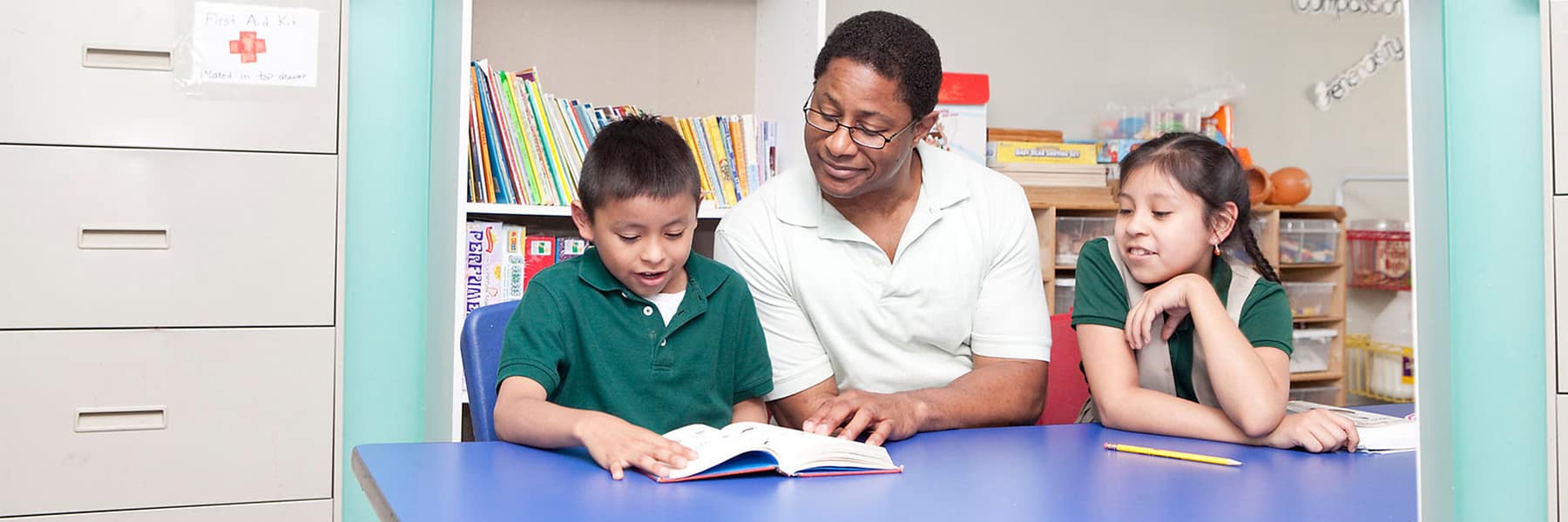 UMass Boston student tutors at Denny afterschool.