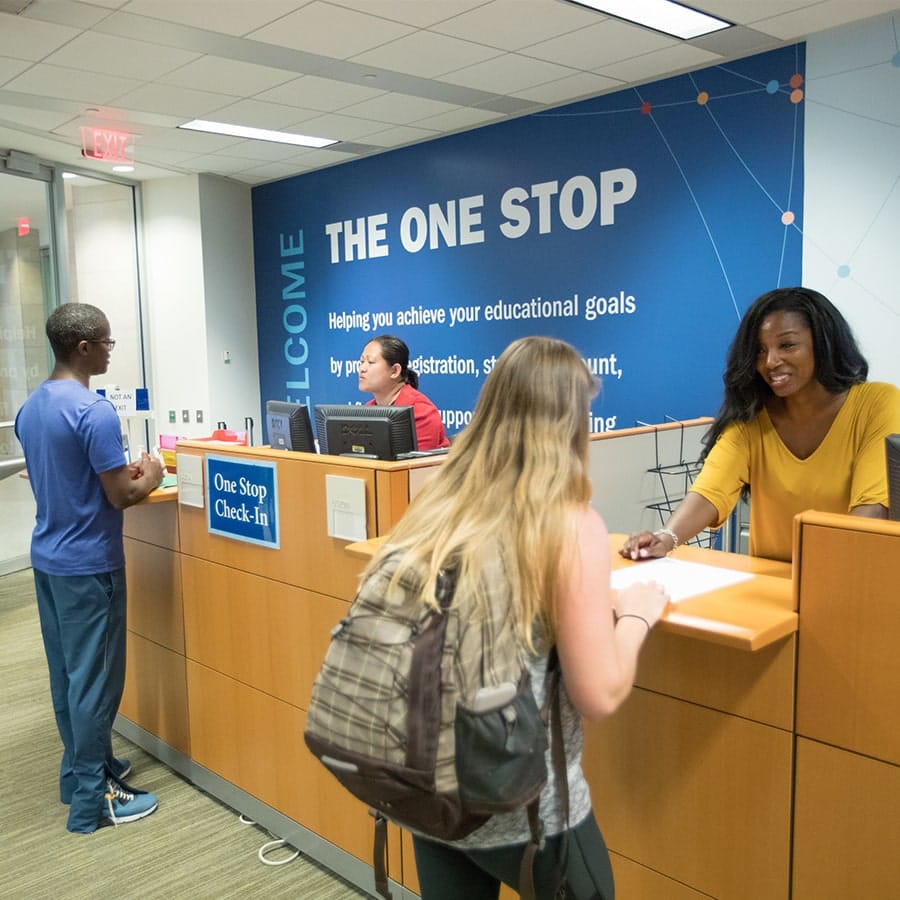 students getting help at Onestop service counter.