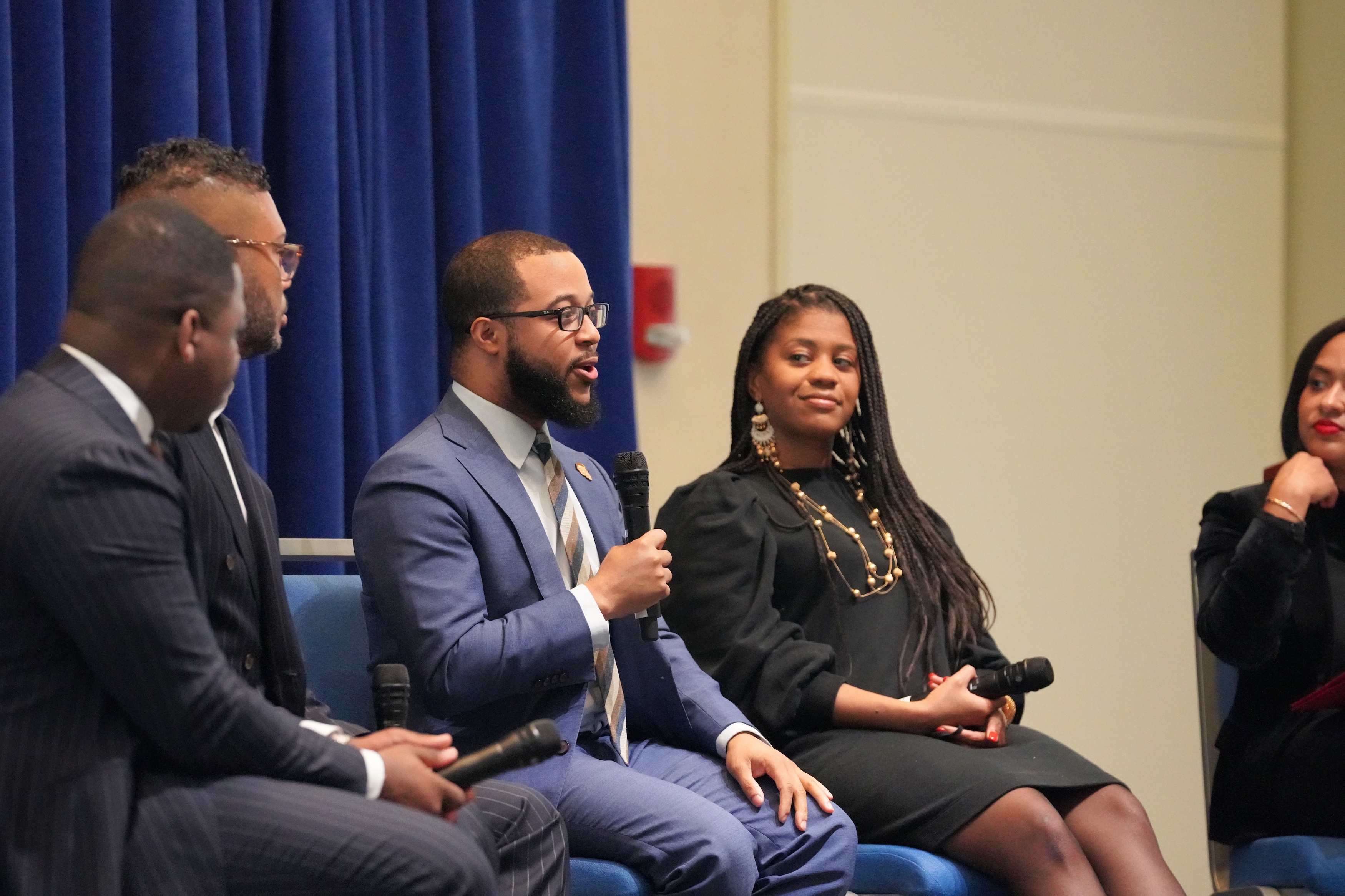 Segun Idowu speaks during a BLM Day panel.  