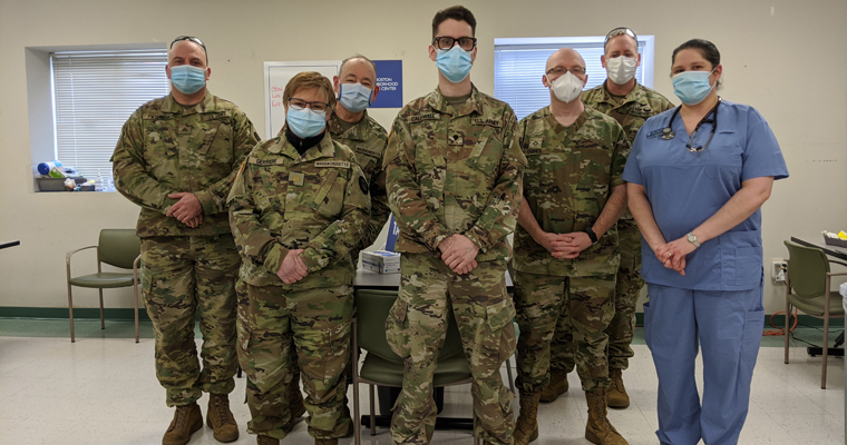 Ariane Theriault and the National Guard at the vaccination clinic