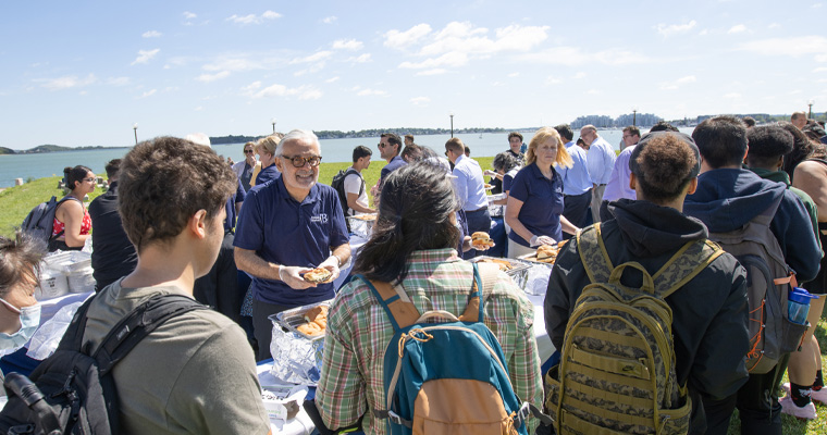 Chancellor serves students at the Convocation Barbeque