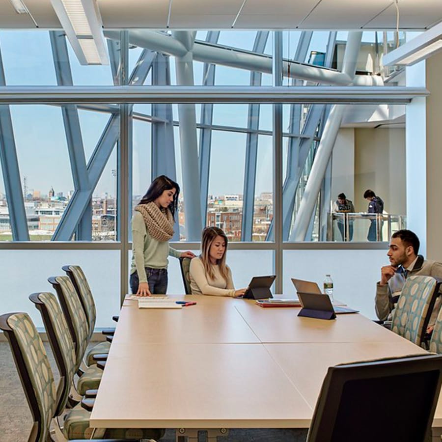 Students work in conference room in the Integrated Sciences Complex.