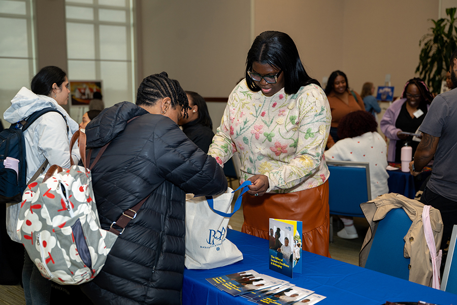 people interacting at BLM Day community fair