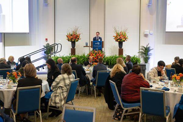 Student speaking to crowd at College of Management 50th Event