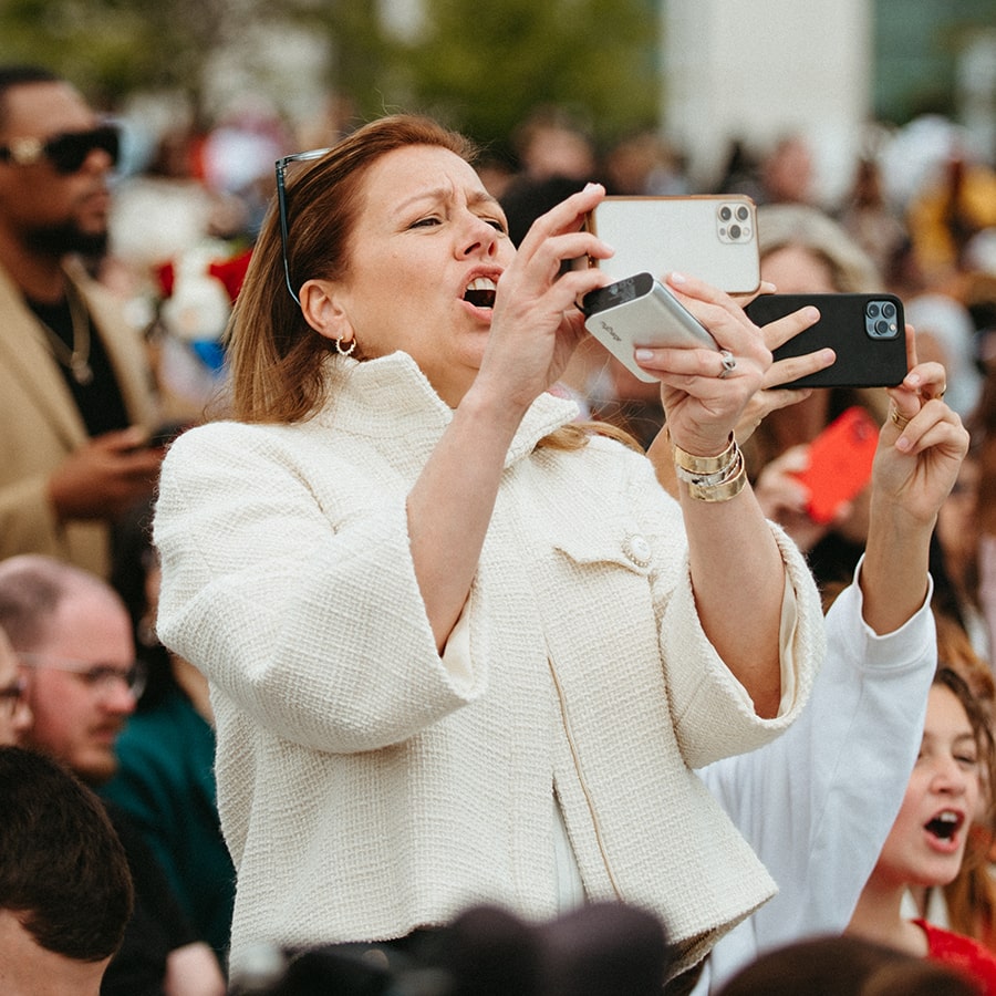 mother taking photo during commencement