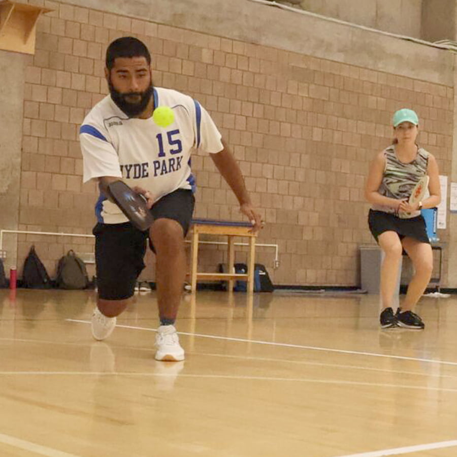 staff play pickleball.